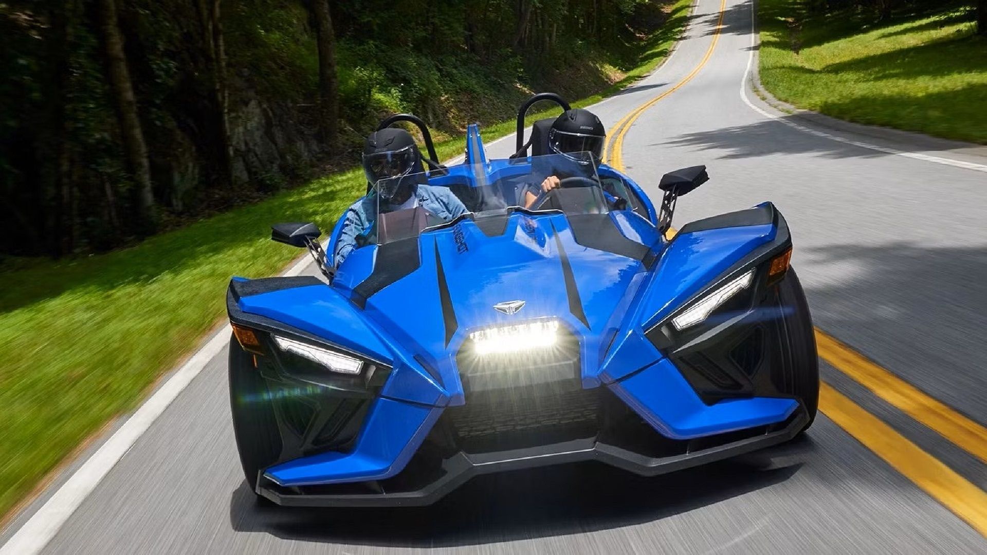 A driving 2023 Polaris Slingshot SL